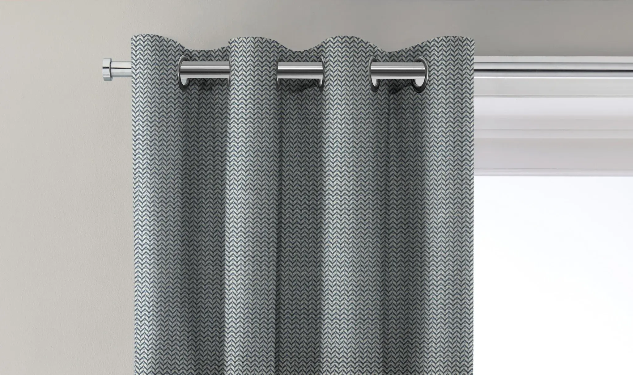 Curtain with an eyelet heading threaded directly onto a pole