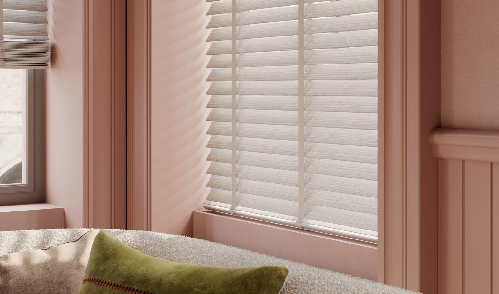 Close-up of white 50mm wooden venetian blind slats with matching decorative ladder tapes
